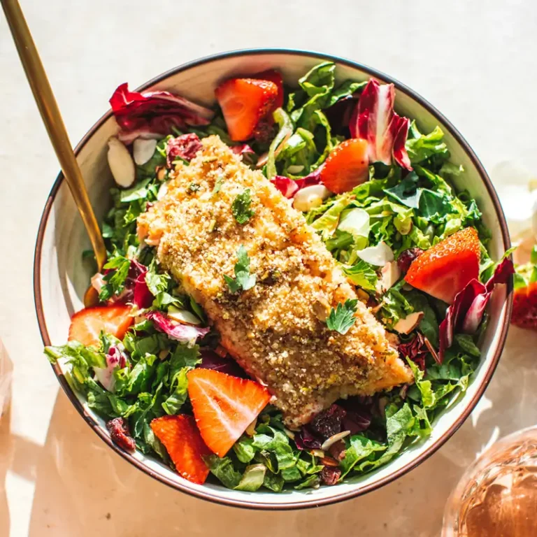 Pistachio-crusted salmon rose salad with fresh greens and vibrant colors, showcasing a healthy and delicious meal option.