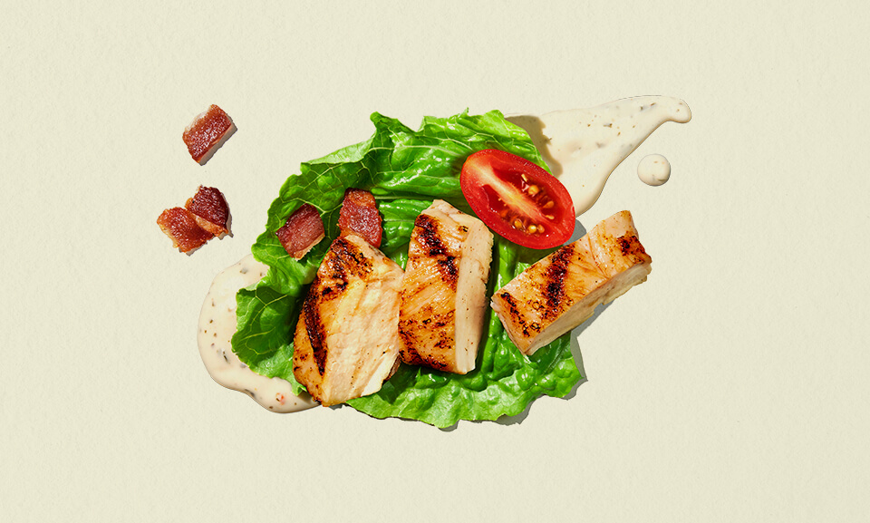 Fresh BLT single-serve salad bowl featuring crispy bacon, lettuce, and tomatoes in a convenient packaging.