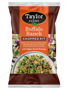 Buffalo ranch salad mix with greens, carrots, and ranch dressing in a bowl, ideal for healthy meals.