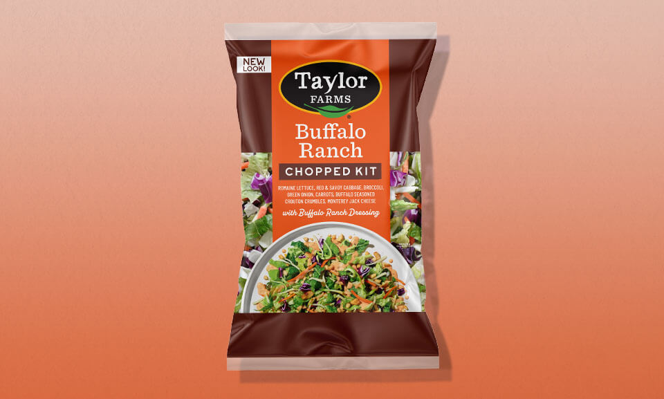 Buffalo Ranch Chopped Salad Kit with vibrant greens, crunchy toppings, and flavorful dressing packed in a sleek package.