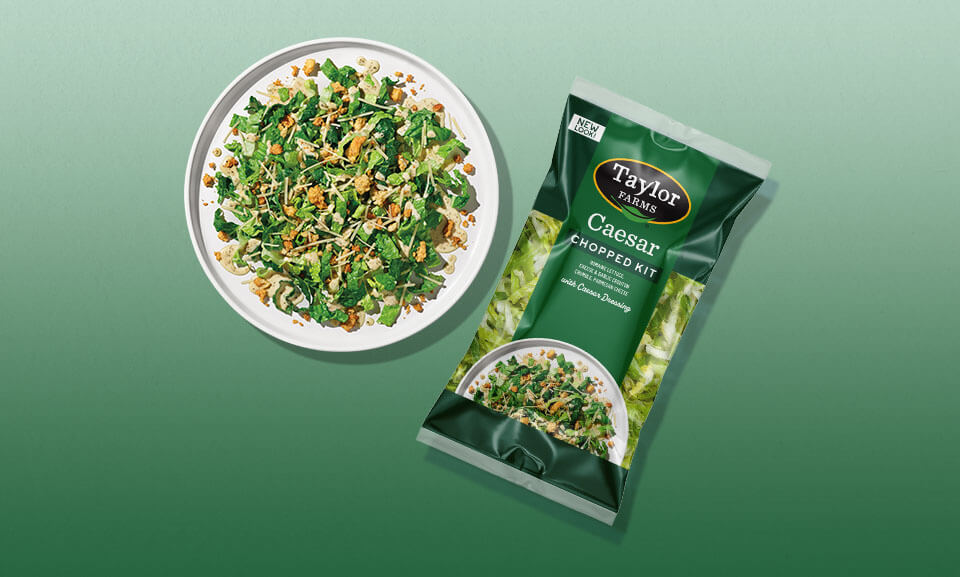 Fresh Caesar salad chopped kit served on a plate with crisp romaine, dressing, and toppings for a delicious meal.