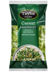 Caesar salad chopped kit featuring fresh romaine, Parmesan cheese, and creamy dressing.