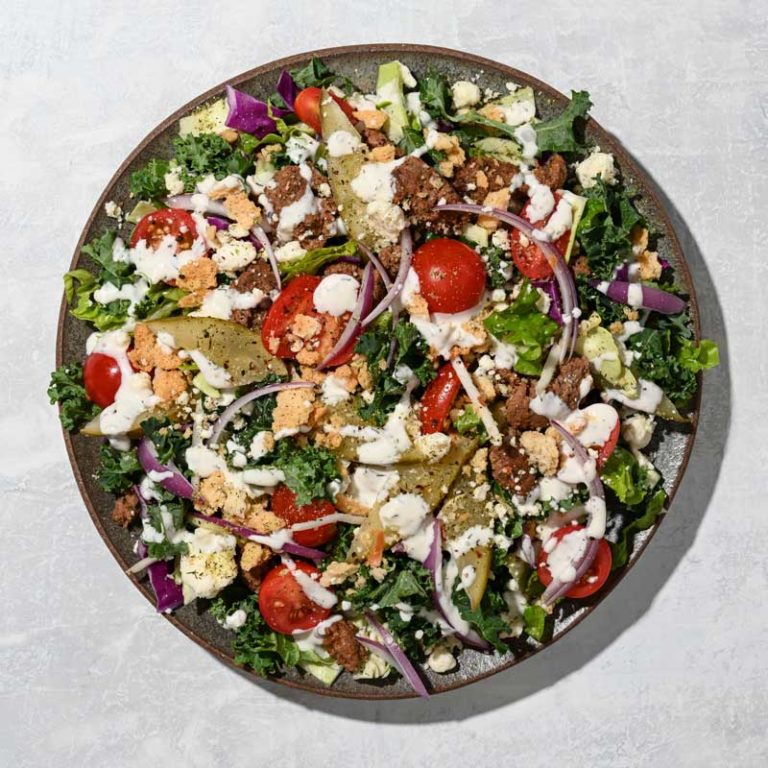 Creamy dill pickle salad featuring fresh ingredients, perfect for summer gatherings and healthy snacking.
