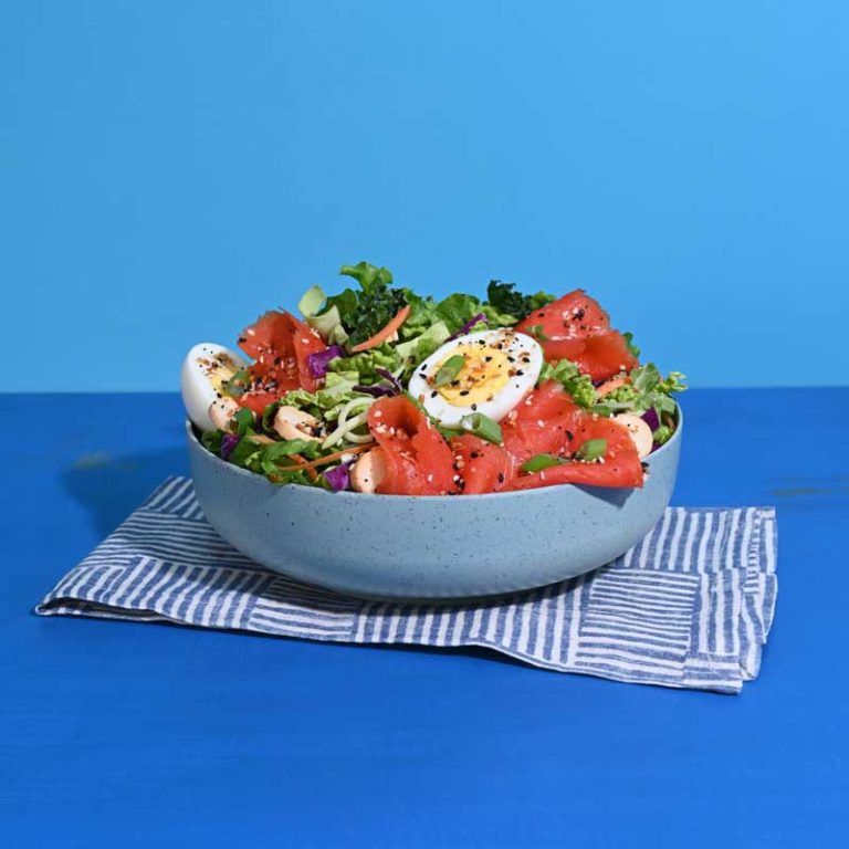 Delicious Everything Lox Salad featuring smoked salmon, fresh greens, and vibrant toppings.
