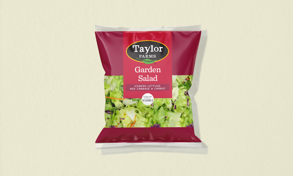 Fresh garden salad blend featuring mixed greens, tomatoes, and carrots in a 12oz package for healthy meal options.