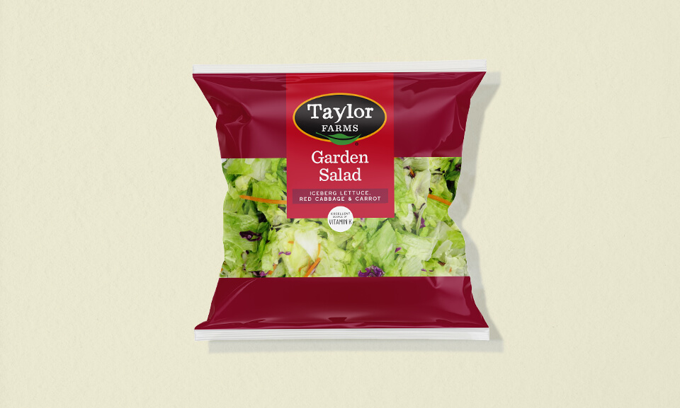 Fresh garden salad blend in a 32 oz package featuring a variety of greens and colorful vegetables.