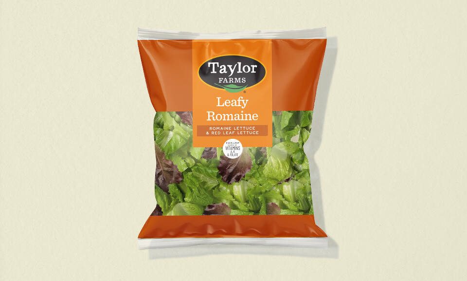 Fresh 9oz Leafy Romaine salad blend with vibrant greens in a clear packaging, perfect for healthy meals and salads.