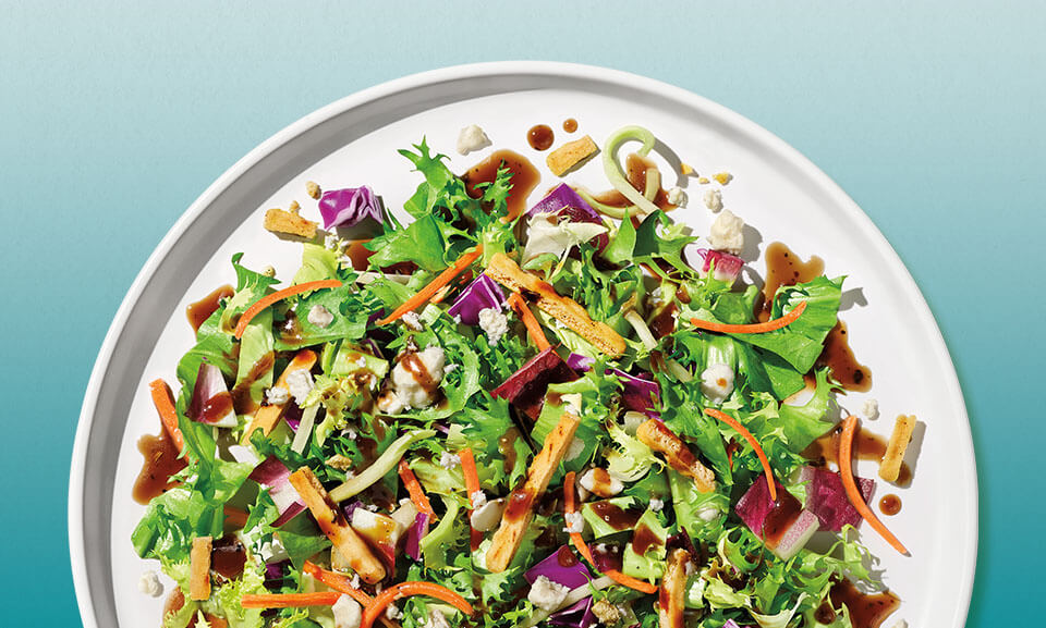Mediterranean Crunch Chopped Salad Kit with fresh vegetables and vibrant ingredients displayed in a bowl.
