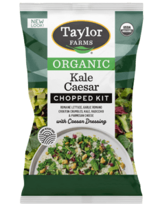 The Organic Kale Caesar Chopped Salad Kit with romaine, kale, radicchio, parmesan cheese, garlic romano crouton crumbles, and creamy Caesar dressing inside.