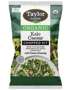 The Organic Kale Caesar Chopped Salad Kit with romaine, kale, radicchio, parmesan cheese, garlic romano crouton crumbles, and creamy Caesar dressing inside.