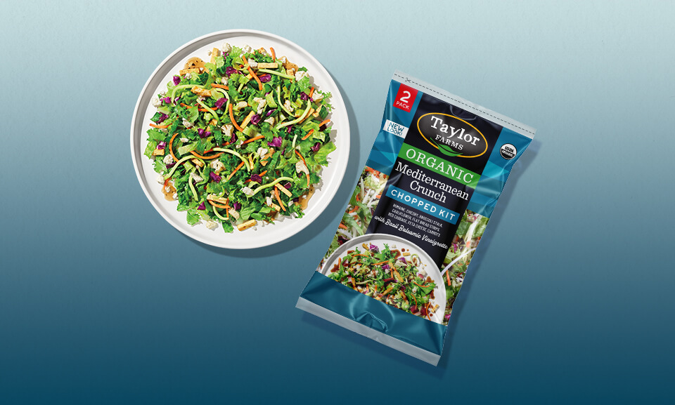 Organic Mediterranean Crunch Chopped Salad Kit displayed on a plate, featuring fresh vegetables and vibrant colors.