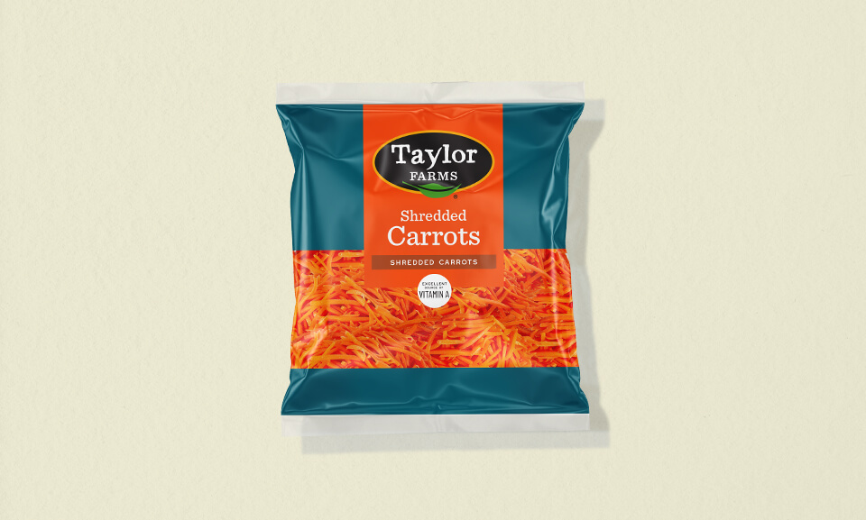 Fresh shredded carrots in an 8oz packaging, ideal for adding crunch and color to salads and dishes.