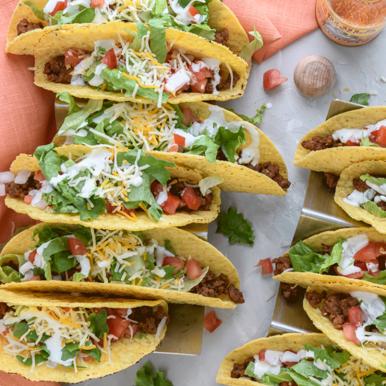 Simple weeknight tacos topped with fresh shredded green leaf lettuce, showcasing a vibrant and delicious meal.