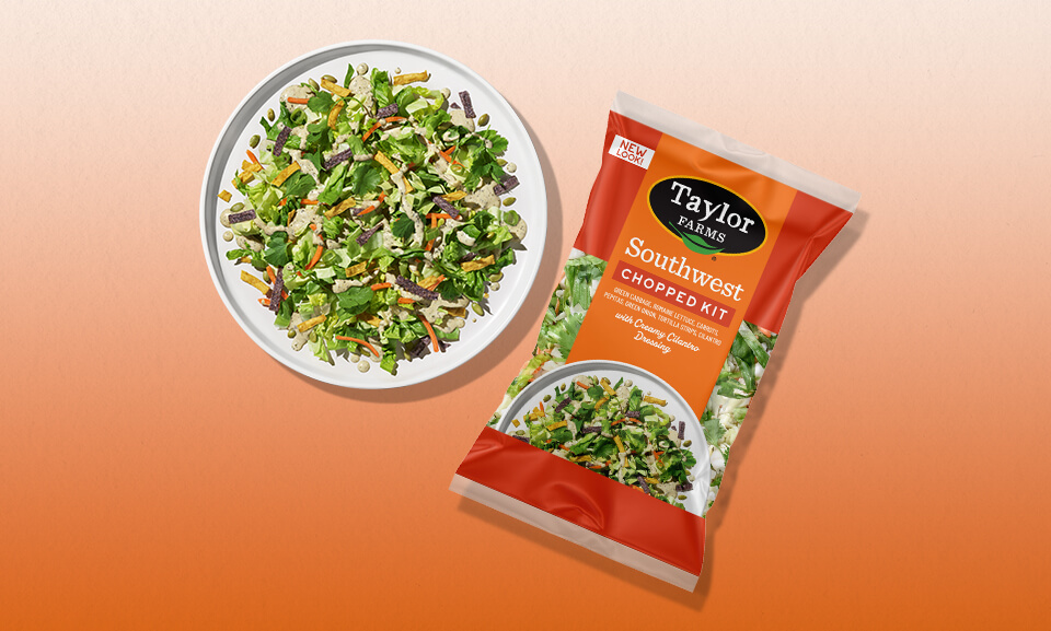 Fresh Southwest Chopped Salad Kit featuring vibrant greens, peppers, corn, and creamy dressing on a plate.