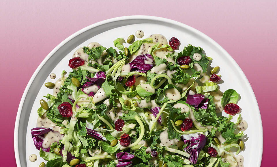 Delicious Sweet Kale Chopped Salad Kit featuring vibrant greens, cabbage, broccoli, and nutritious toppings.