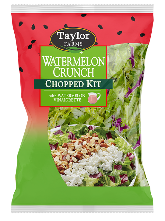 The Watermelon Crunch Chopped Salad Kit with romaine lettuce, radicchio, roasted almonds, roasted watermelon seeds, and feta cheese, which is topped with a watermelon lime vinaigrette.