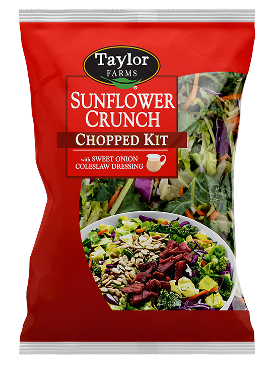 The Sunflower Crunch Chopped Salad Kit, with fresh green leaf, kale, sunflower seeds, and crumbled bacon tossed with a sweet onion coleslaw dressing.