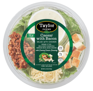 Ready-to-eat Caesar salad bowl with bacon, greens, and dressing from Taylor Farms.