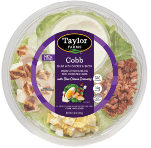 Cobb salad in a ready-to-eat bowl featuring greens, chicken, cheese, egg, and dressing from Taylor Farms.