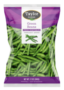 The Taylor Farms Green Beans package showing fresh whole green beans in a sealed plastic bag.