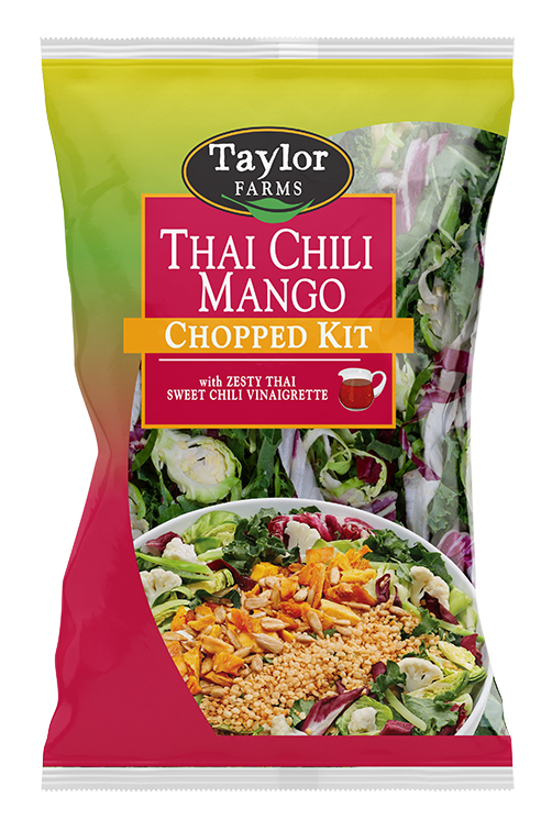 The Thai Chili Mango Chopped Salad kit package, showing chopped cauliflower, Brussels sprouts, broccoli, radicchio, green cabbage, and kale, which are topped off with sunflower seeds, dried mango, toasted quinoa, and a Thai Sweet Chili Vinaigrette dressing.