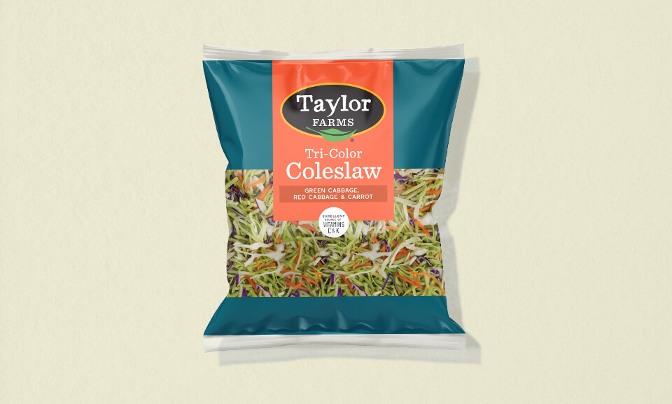 Tricolor coleslaw mix in a 14oz package, featuring vibrant cabbage and carrots for fresh salads and sides.