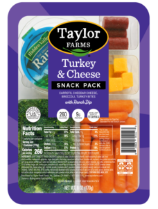 Turkey and cheese sandwich with fresh vegetables on whole grain bread.