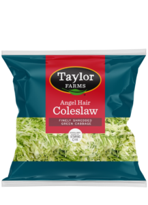 Fresh and colorful Taylor Farms salad kit with various vegetables and dressing, perfect for quick and healthy meals.