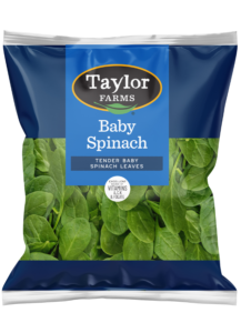 Freshly packaged Taylor Farms salad blend with vibrant greens and vegetables, perfect for healthy meals and quick recipes.