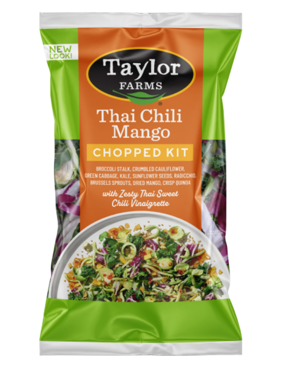 The Thai Chili Mango Chopped Salad kit package, showing chopped cauliflower, Brussels sprouts, broccoli, radicchio, green cabbage, and kale, which are topped off with sunflower seeds, dried mango, toasted quinoa, and a Thai Sweet Chili Vinaigrette dressing.