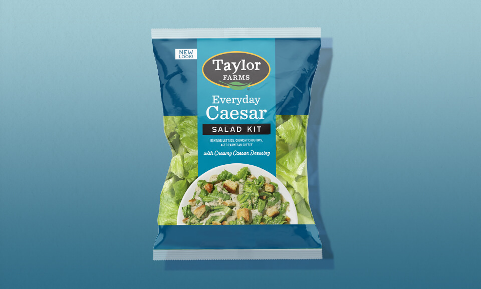 Fresh Caesar salad kit with romaine lettuce, Parmesan cheese, and creamy dressing for a quick, convenient meal option.