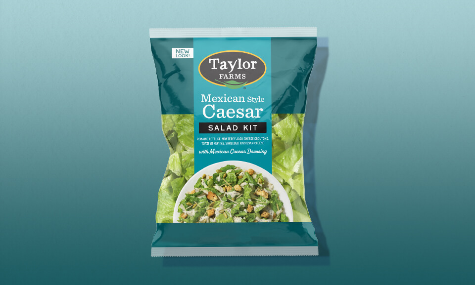 Mexican Style Caesar Salad Kit featuring fresh greens, crispy tortilla strips, and zesty dressing.
