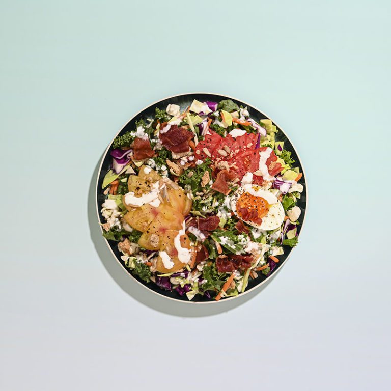 Organic artisan ranch salad mix featuring fresh greens and vegetables in a vibrant, colorful presentation.