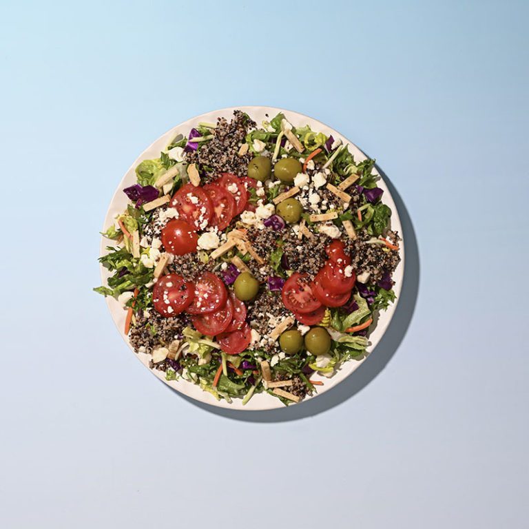 Organic Mediterranean Crunch salad featuring fresh greens, colorful vegetables, and a blend of herbs and spices.