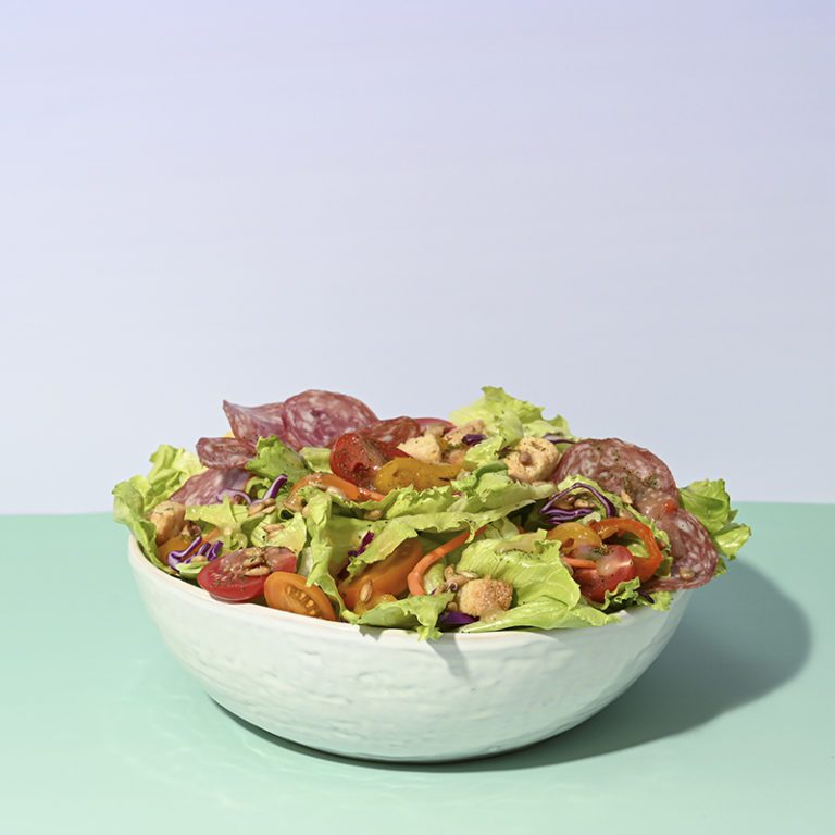 Fresh Italian salads featuring vibrant vegetables, herbs, and dressings from Taylor Farms.