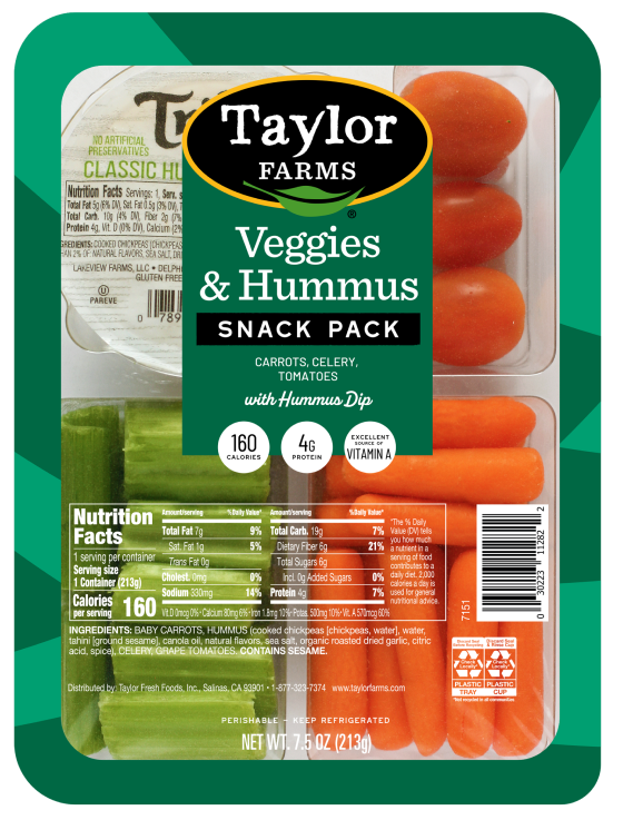 Colorful platter of fresh veggies with creamy hummus dip, perfect for healthy snacking or appetizers.