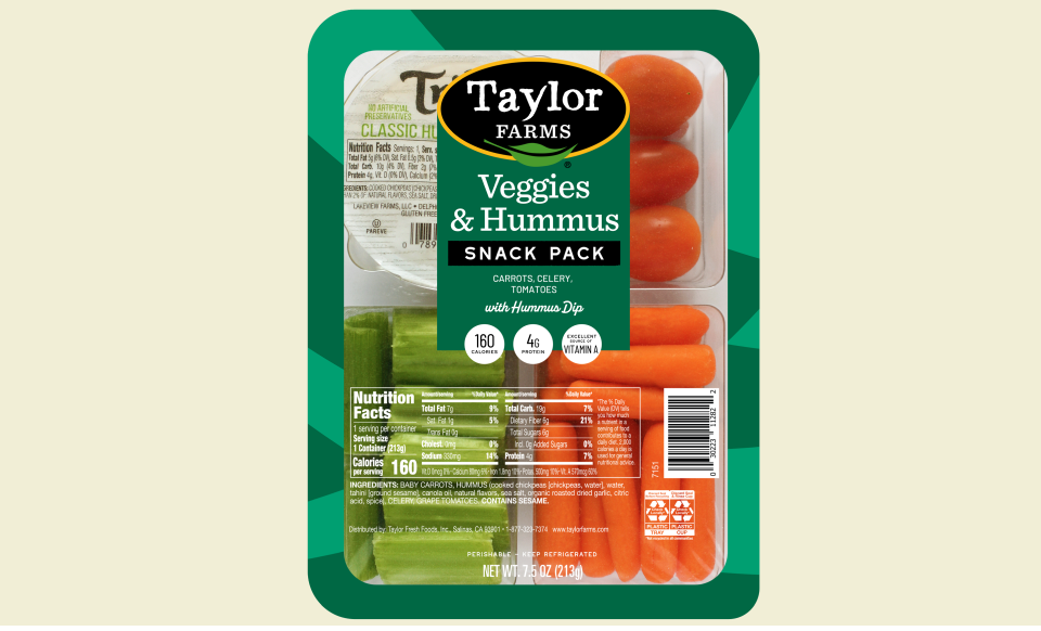 Fresh veggies and hummus served in a vibrant presentation, perfect for healthy snacking and entertaining.