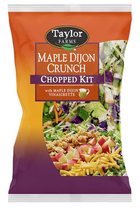 The Taylor Farms Maple Dijon Crunch Chopped Salad Kit with diced red apples, broccoli, green leaf lettuce, savoy cabbage, carrot, and red cabbage, warmly-spiced, fall-inspired crouton crumbles, sharp cheddar cheese, and a sweet & savory maple Dijon vinaigrette