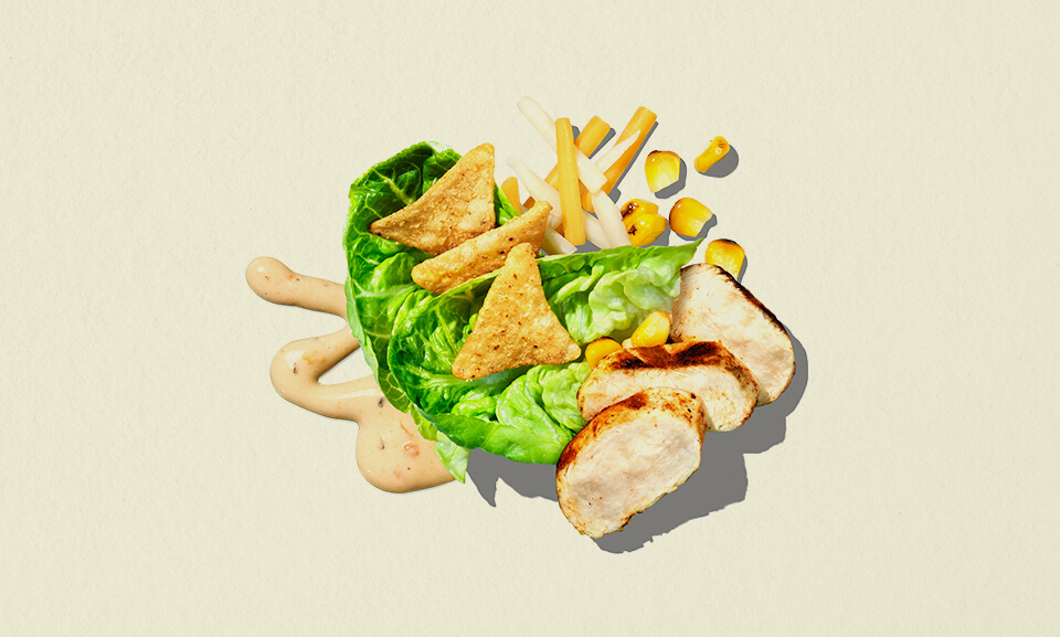 Fiesta Chicken single-serve salad bowl featuring fresh greens, grilled chicken, and vibrant toppings.