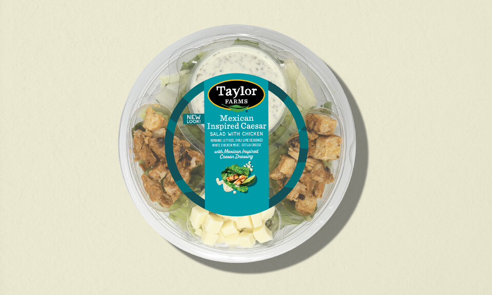 Mexican-inspired Caesar salad single-serve bowl with fresh ingredients in vibrant packaging.