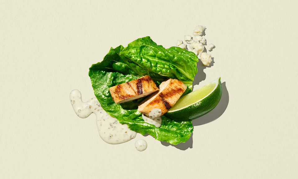 Mexican-inspired Caesar salad bowl featuring fresh greens, grilled chicken, and zesty dressing, perfect for a nutritious meal.