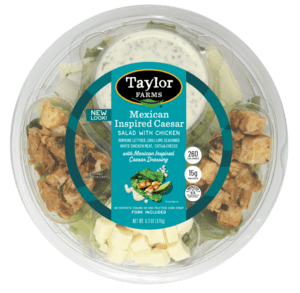 Mexican-inspired Caesar salad in a ready-to-eat bowl, featuring fresh greens, croutons, and vibrant toppings.
