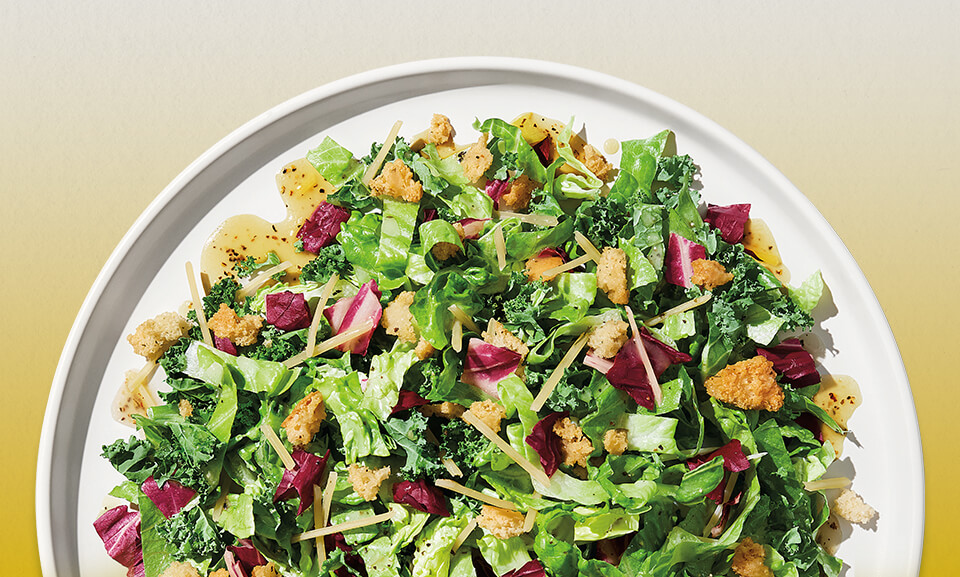 Organic Lemon Parmesan salad featuring fresh greens and vibrant toppings.