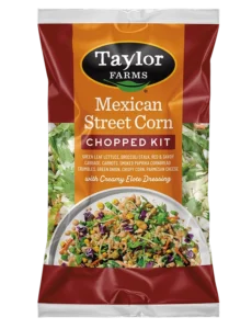 Delicious Mexican street corn topped with spices, cheese, and herbs, showcasing vibrant colors and textures.