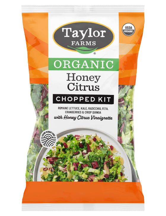 The Honey Citrus Chopped Salad Kit package with green leaf lettuce, red & savoy cabbage, broccoli, carrot, green onion, dried cranberries, feta cheese crumbles, crisp quinoa with honey citrus vinaigrette.