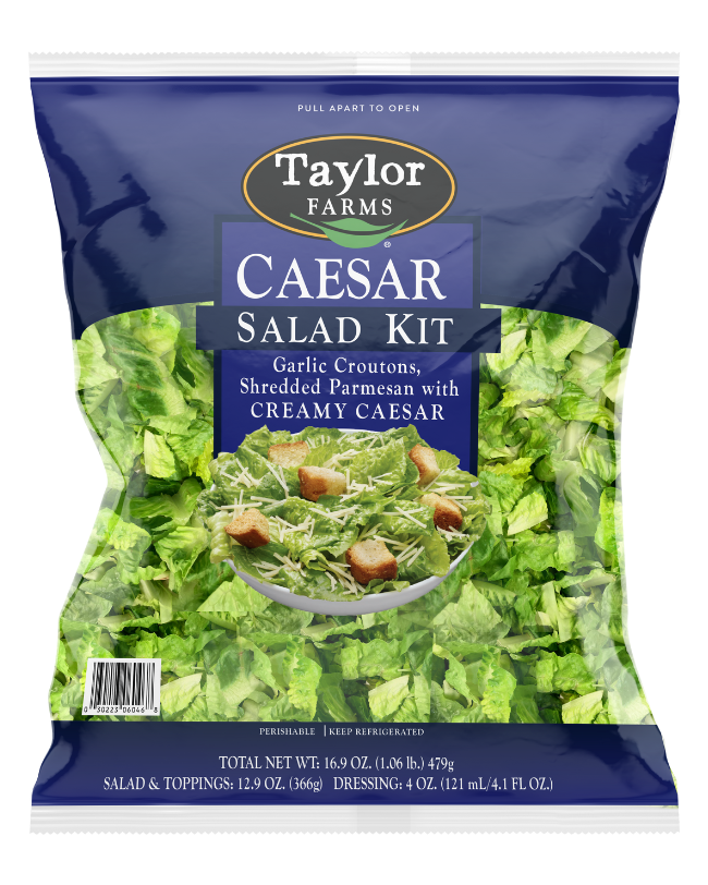 The Taylor Farms Caesar Salad Kit with chopped Romaine lettuce, bite-size croutons, shredded parmesan cheese, and creamy Caesar dressing.