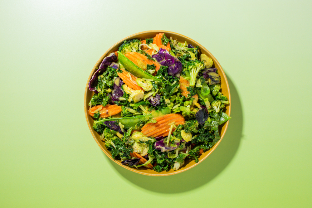 Taylor Farms Coconut curry meal kit in a bowl on a green background