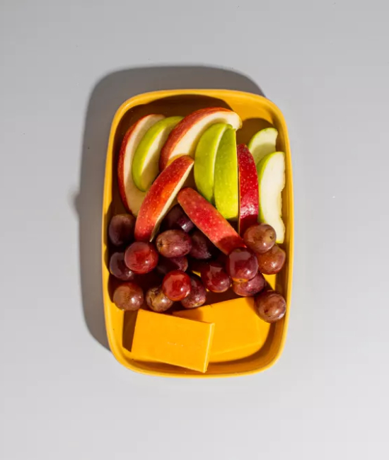 Taylor Farms fruit & cheese snack pack on a plate