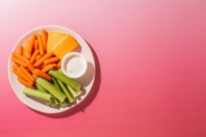 Taylor Farms Veggies & Cheese snack pack on a plate