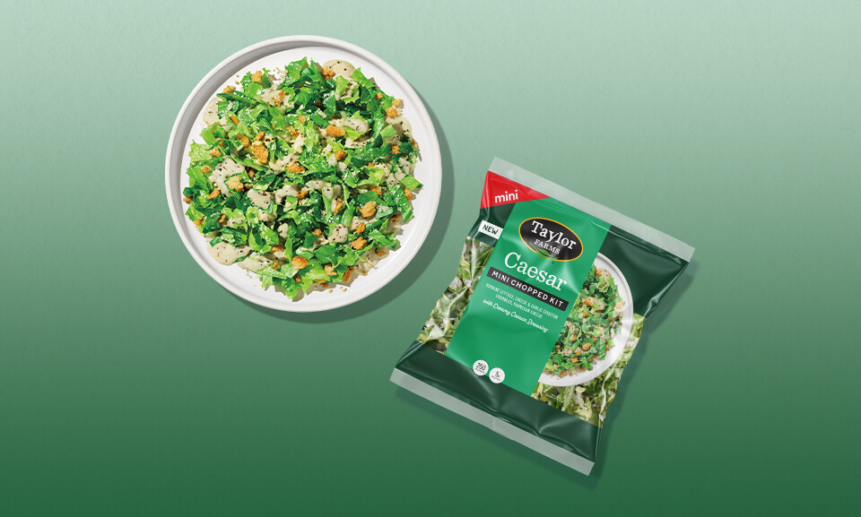 Fresh Caesar Mini Chopped Kit featuring crisp romaine, parmesan cheese, and Caesar dressing. Ideal for healthy meals.